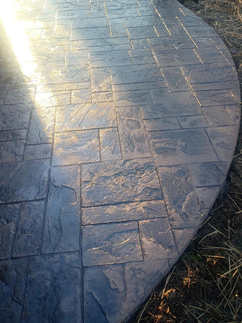 Professionally installed concrete patio enhancing outdoor living space with expert concrete, grading, and landscaping services in Greensboro, NC