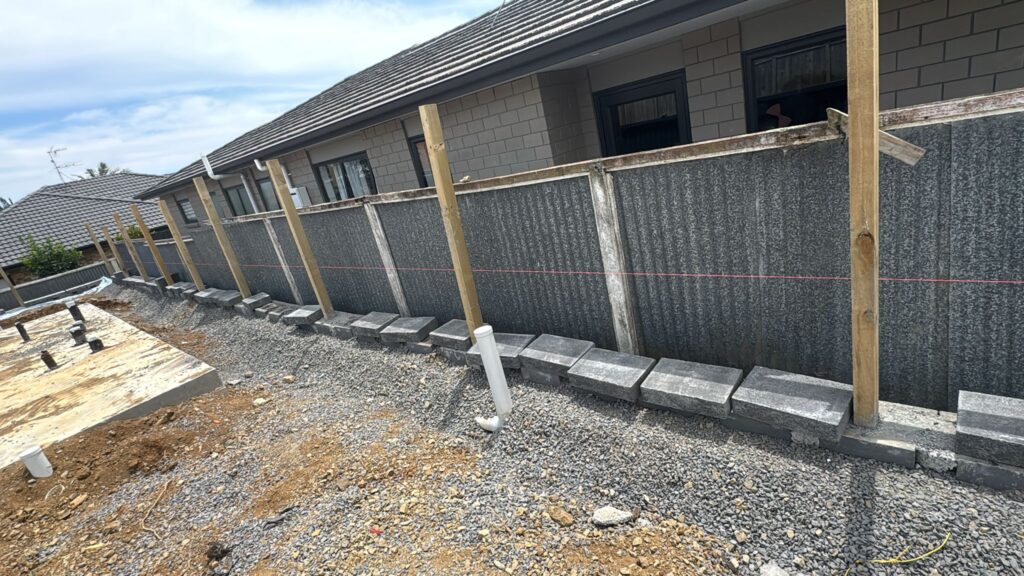 Professional retaining wall installation for a landscaped property in Greensboro NC