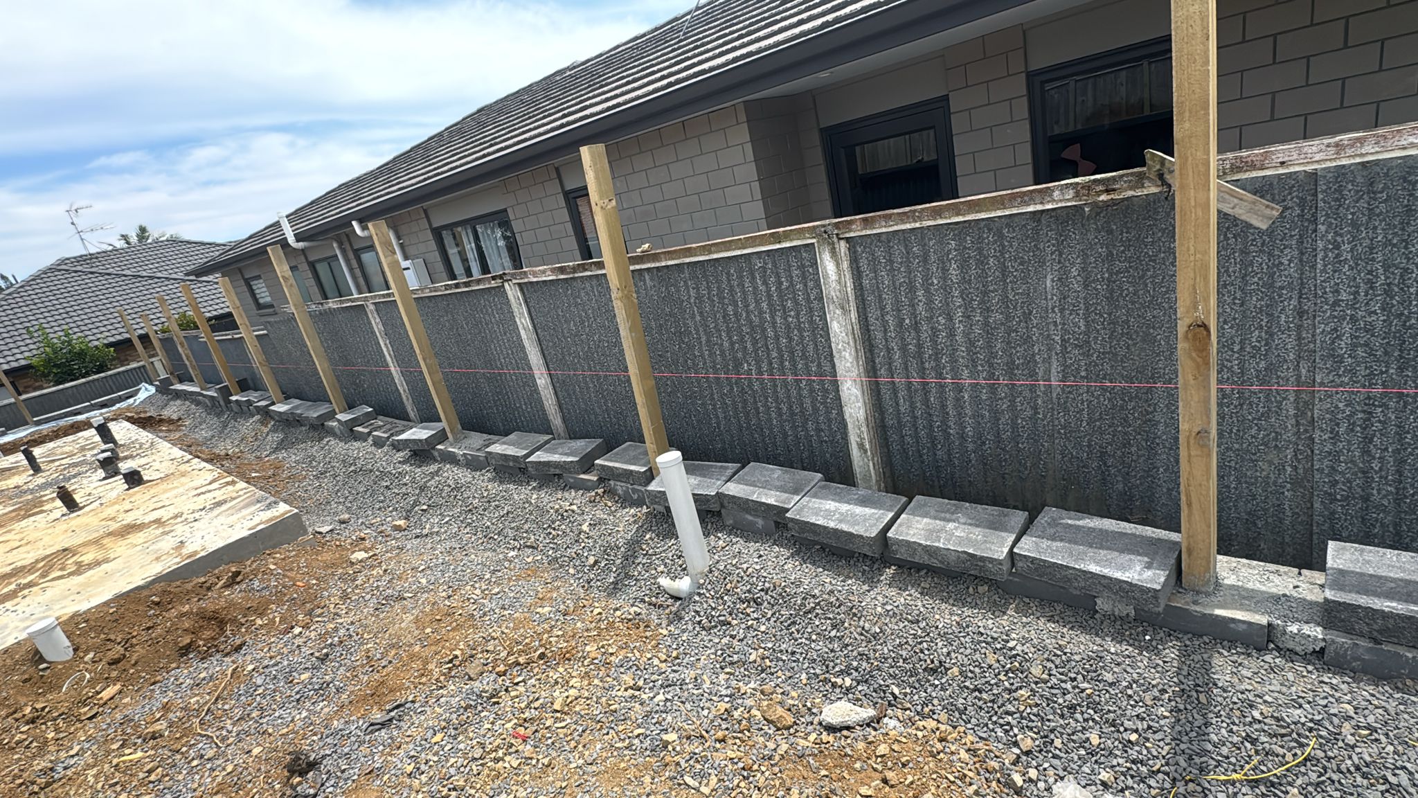 Professional retaining wall installation for a landscaped property in Greensboro NC