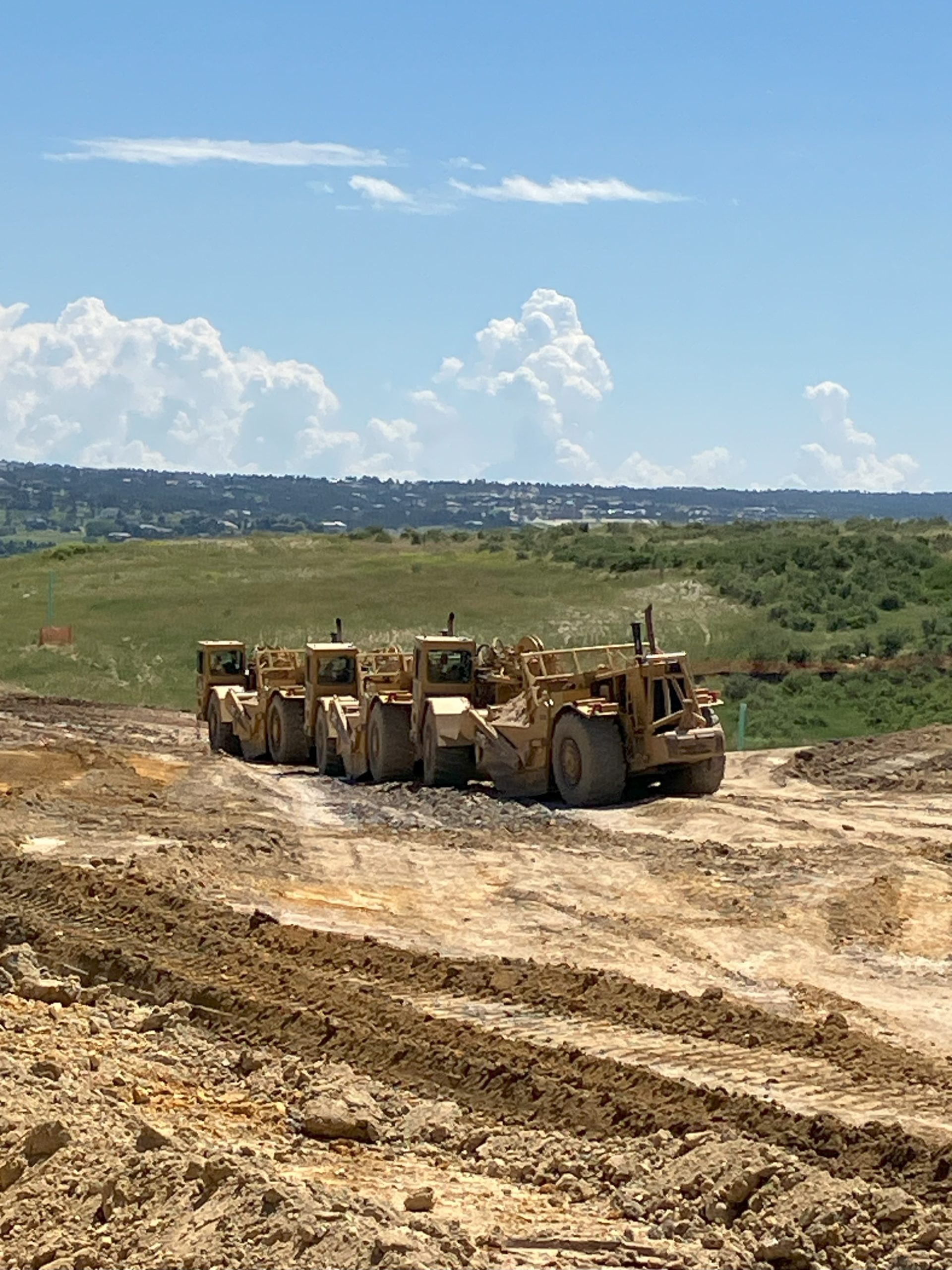 Bulldozer grading and preparing land for construction and outdoor improvements in High Point, NC.