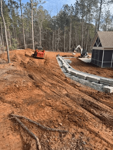 Professional land grading and drainage preparation for a residential property in Summerfield, NC