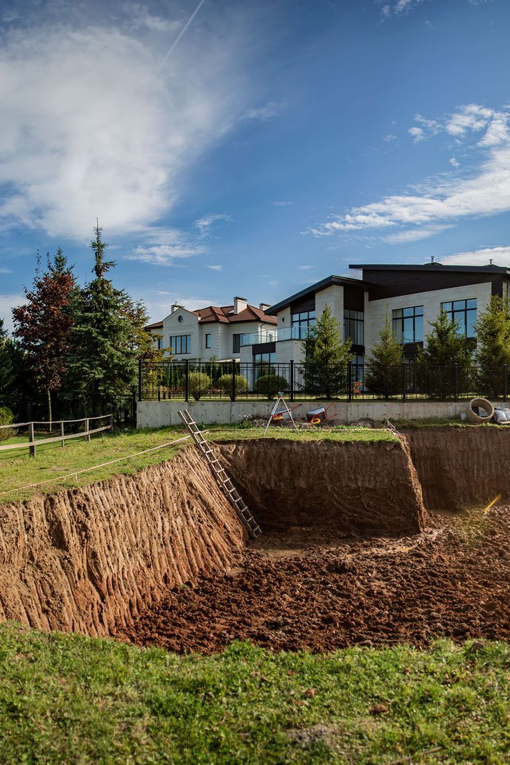 Professional land grading and excavation site preparation near a residential property in Kernersville, NC